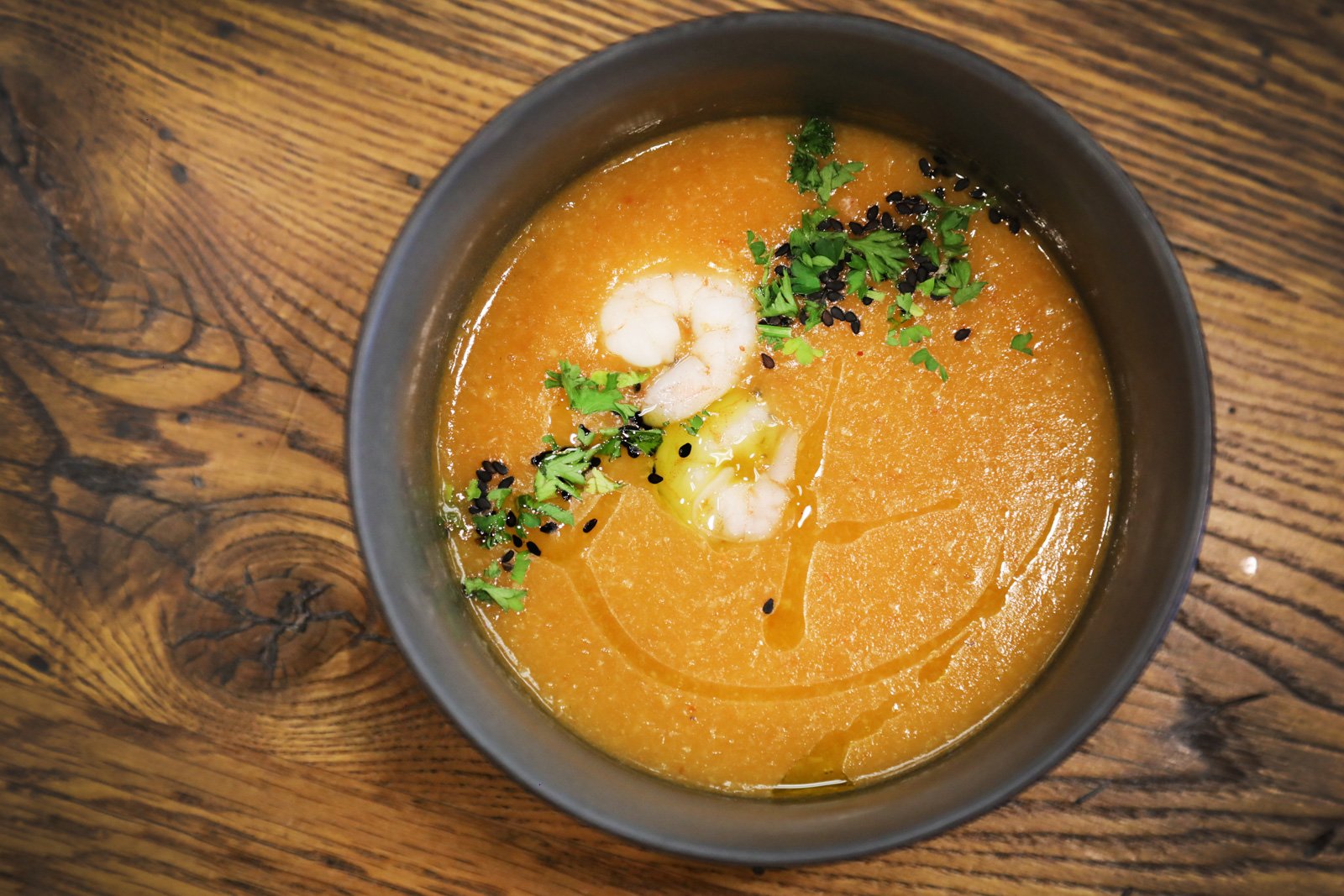 soup with fresh herbs on top